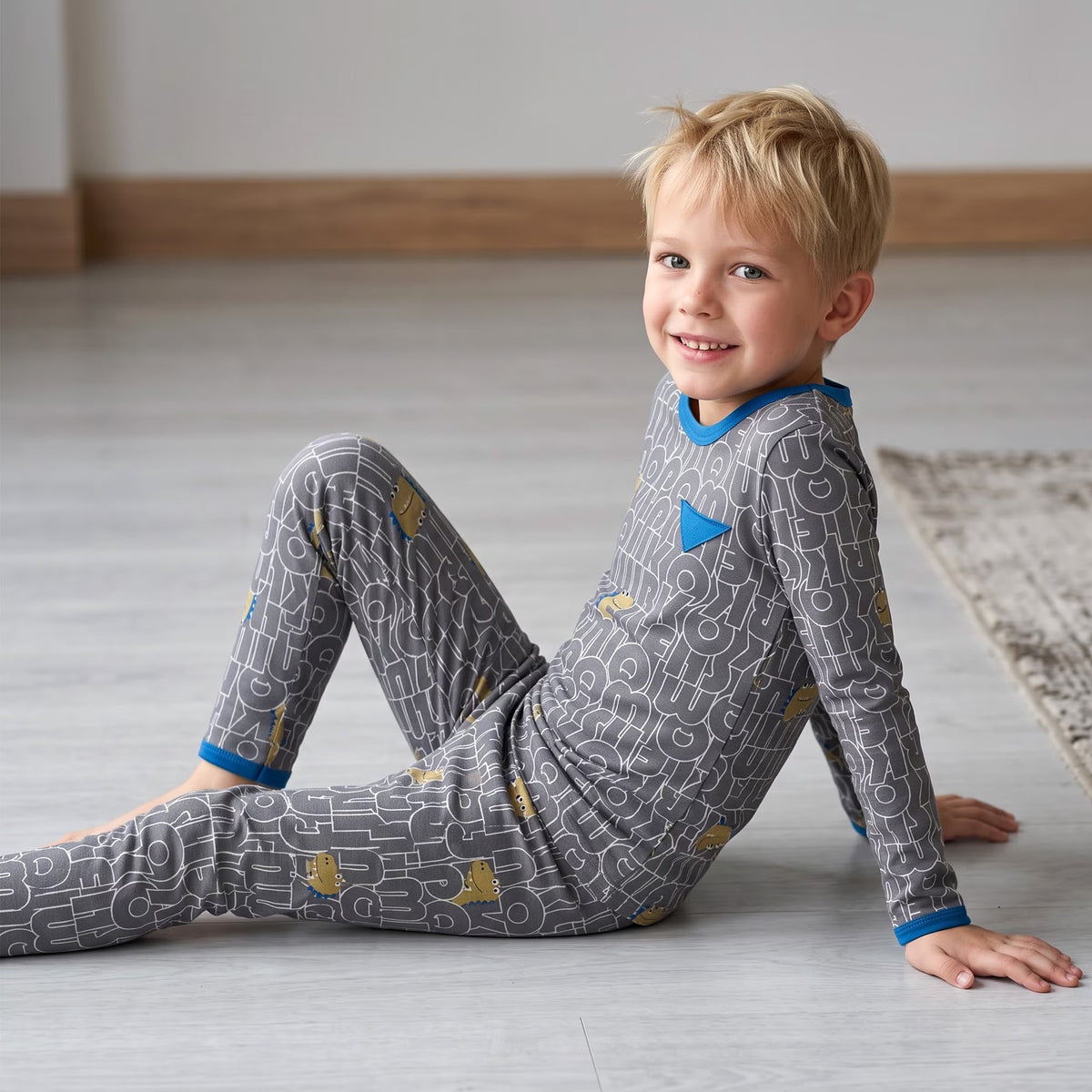 NIPAXO Boys Pajamas Set Long Sleeve Dinosaur Letter Print Casual Sleepwear with Blue Trim for Toddler Little Boys